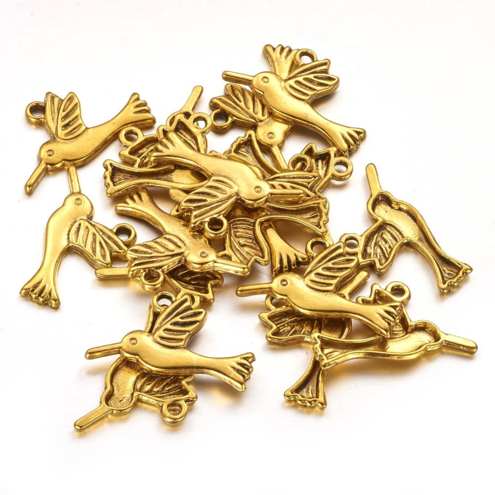 PandaHall Tibetan Style Hummingbird Pendants, Lead Free and Cadmium Free, Bird, Antique Golden, 26mm long, 14mm wide, 2.5mm thick, hole: 2mm...