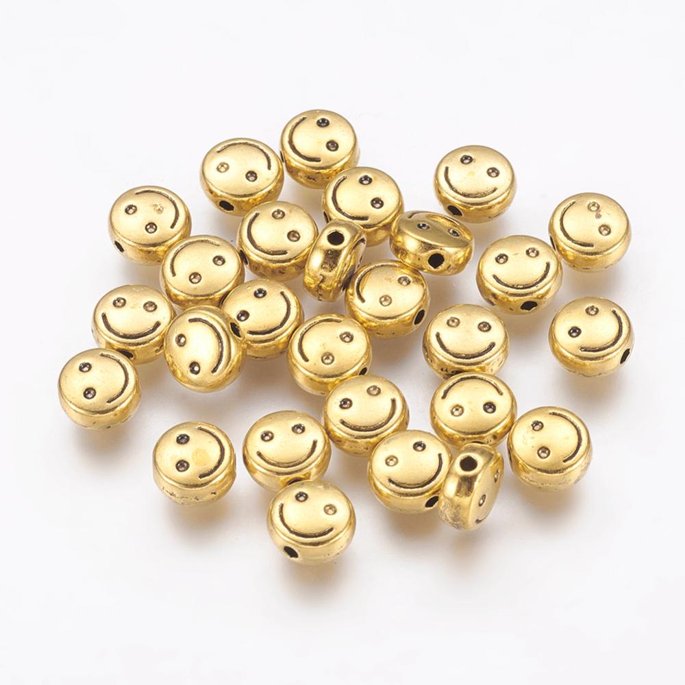 PandaHall Tibetan Style Flat Round Carved Smiling Face Beads, Lead Free & Cadmium Free, Antique Golden, 6x3mm, Hole: 1mm Alloy Flat Round